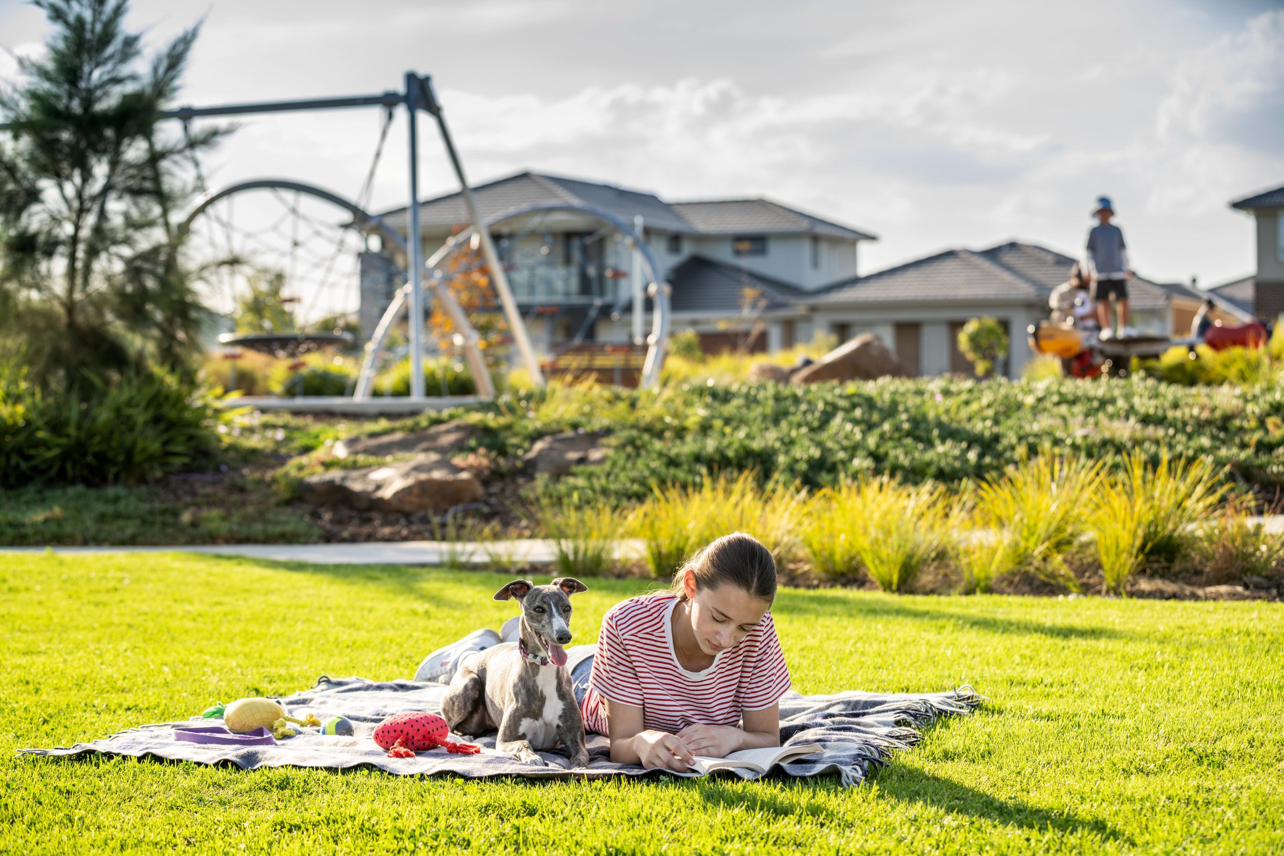 kid and dog in the park